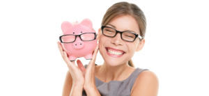 Woman smiling with eyeglasses holding a piggy bank with eyeglasses