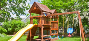 Play house with slides, swings in the playground