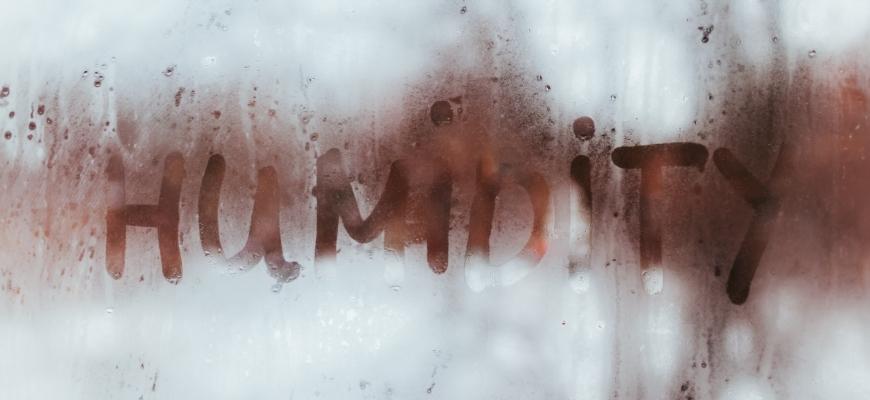 Humidity word written on wet window